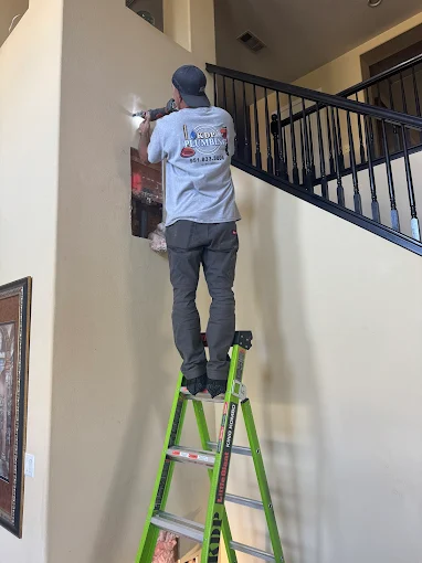 KDP Plumbing technicians working at a home